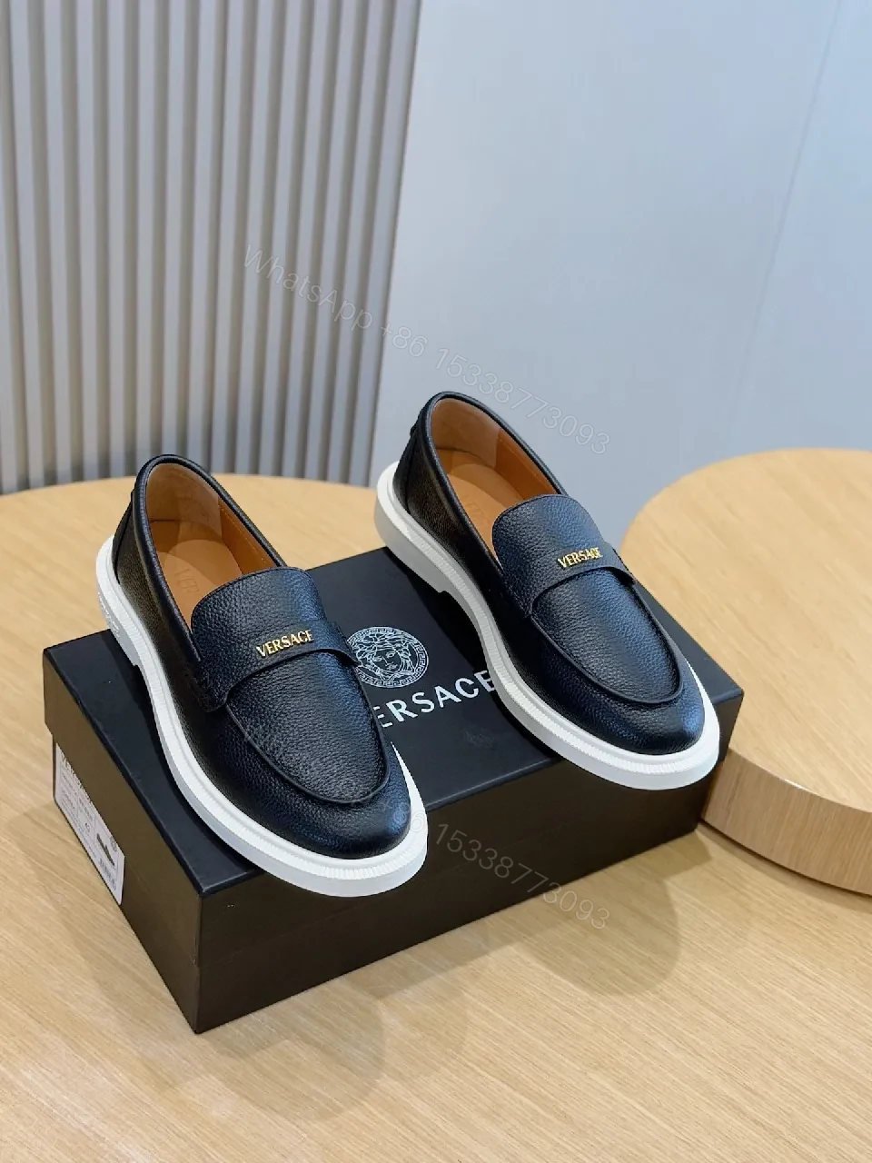 Navy Leather Penny Loafers with Gold Hardware & White Sole — view 1