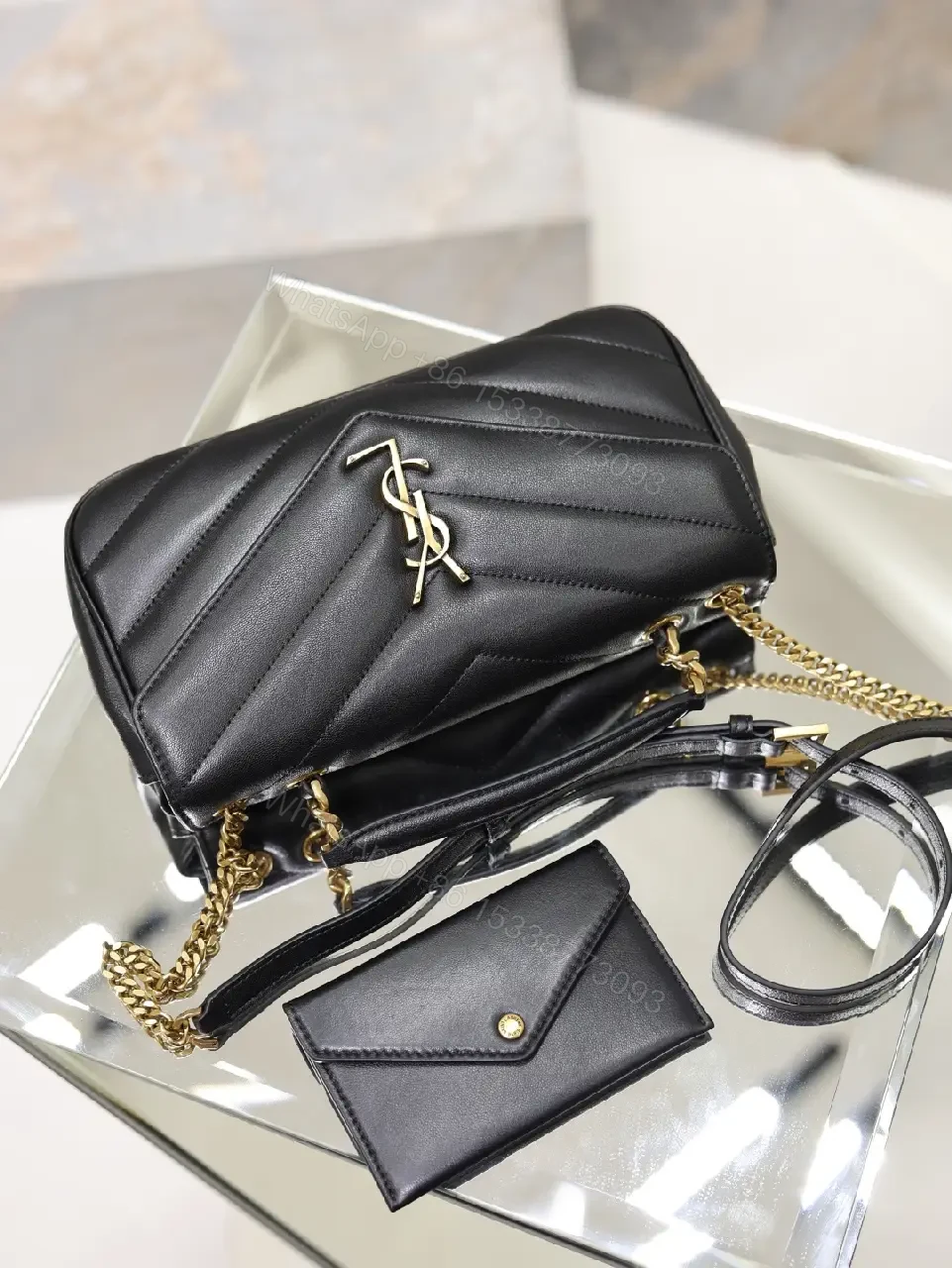 View 2 of Black Leather Structured Shoulder Bag Envelope Flap with YSL Logo Product Type