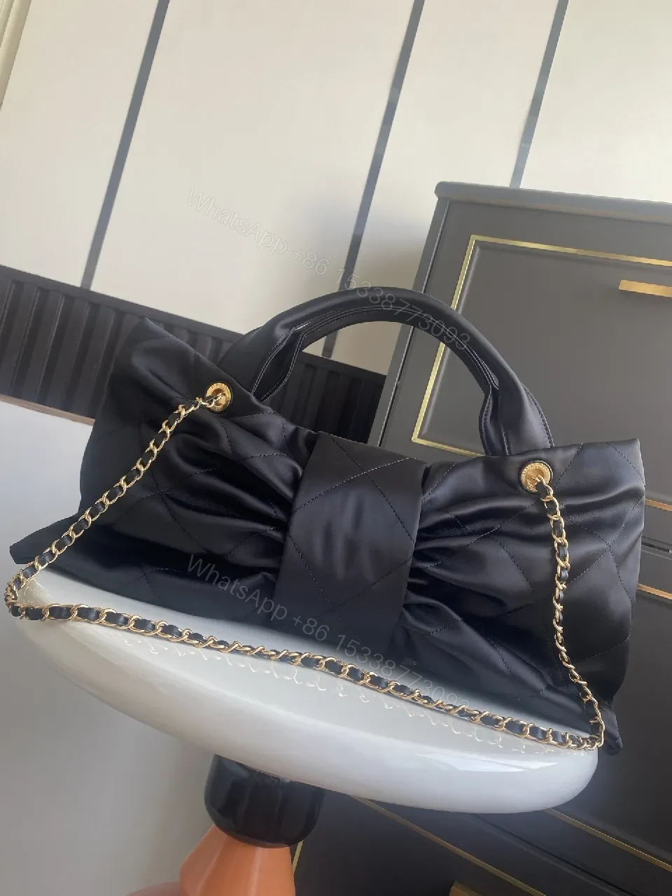 View 4 of Quilted Black Bag with Gold Emblem - Luxury Everyday Style