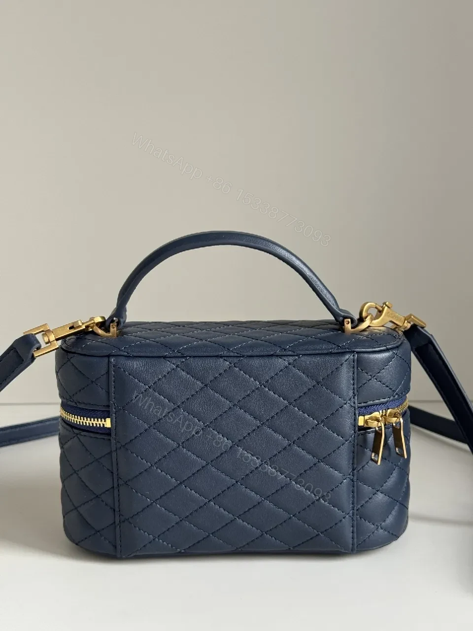 View 4 of Navy Quilted Leather Crossbody Bag with Gold Hardware
