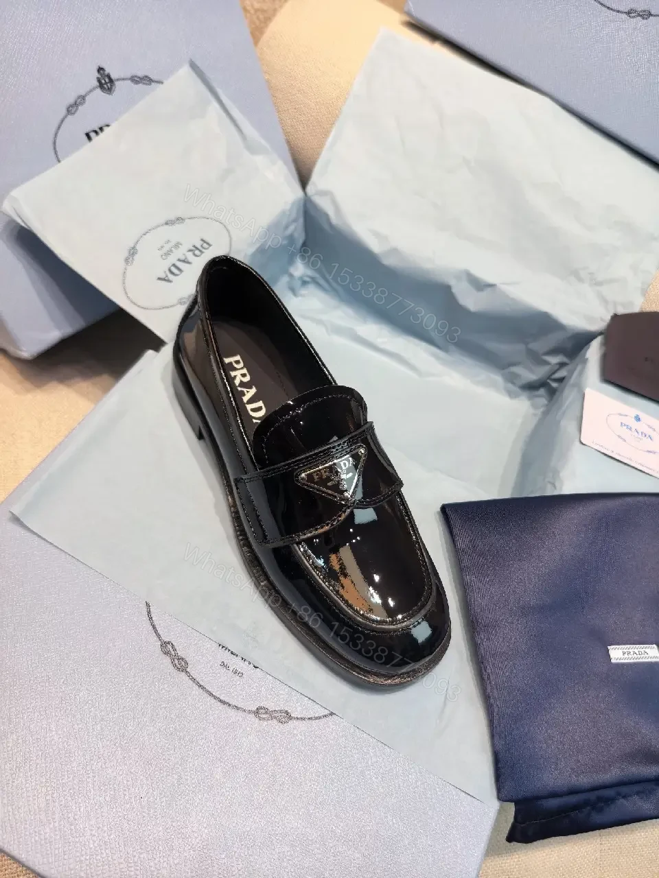 View 10 of Black Patent Leather Loafers Prada Style Feature: Logo Detail Shoe Type: Loafers