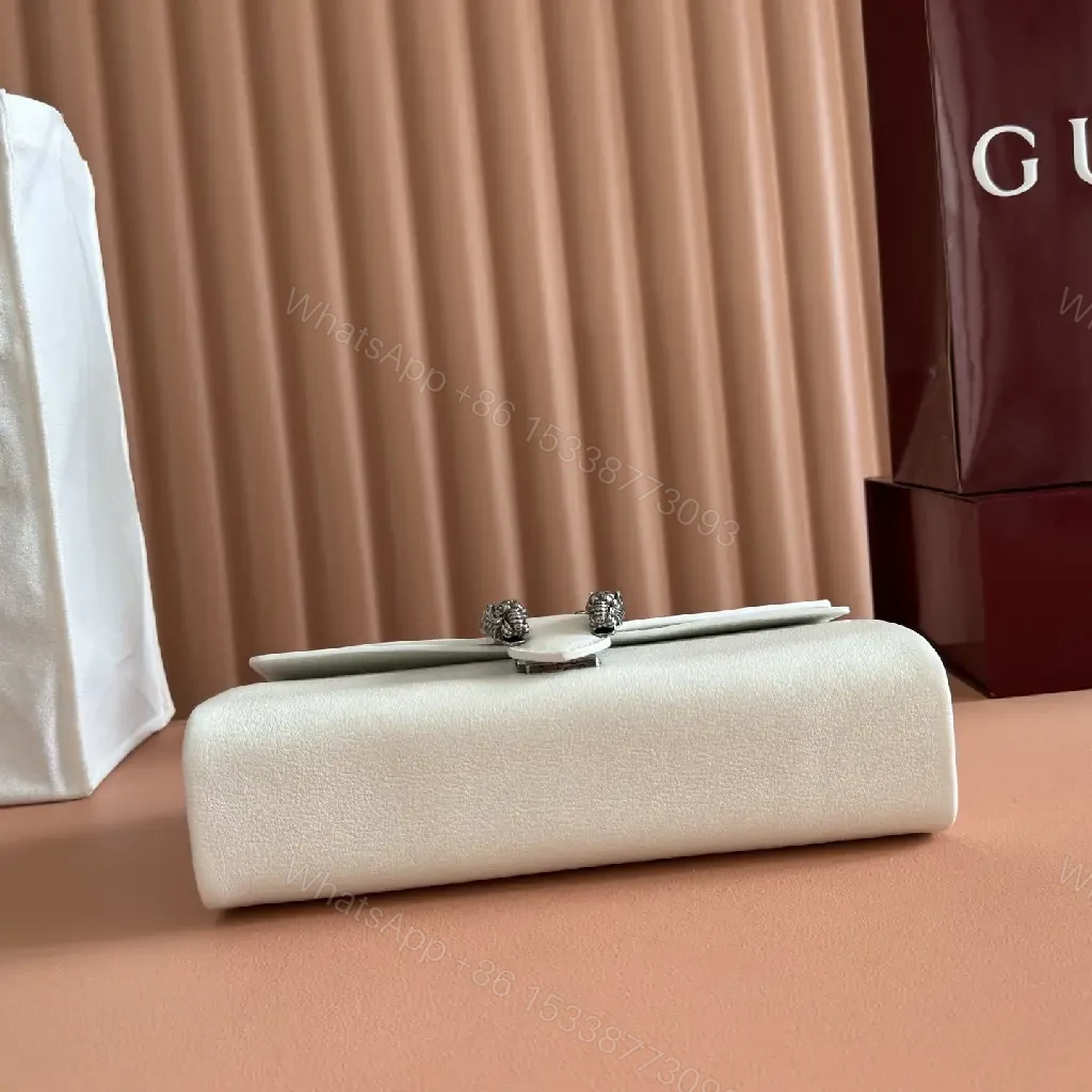 View 7 of Off-White Cream Pebbled Leather Structured Flap Bag with Gold Horseshoe Clasp