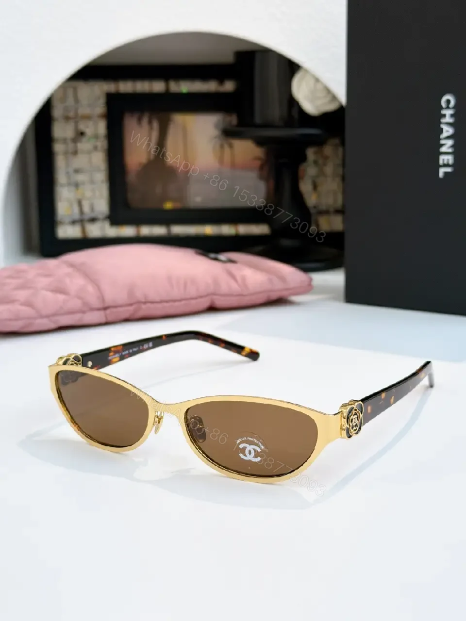 View 9 of Gold Cat-Eye Sunglasses with Chanel Logo Accents