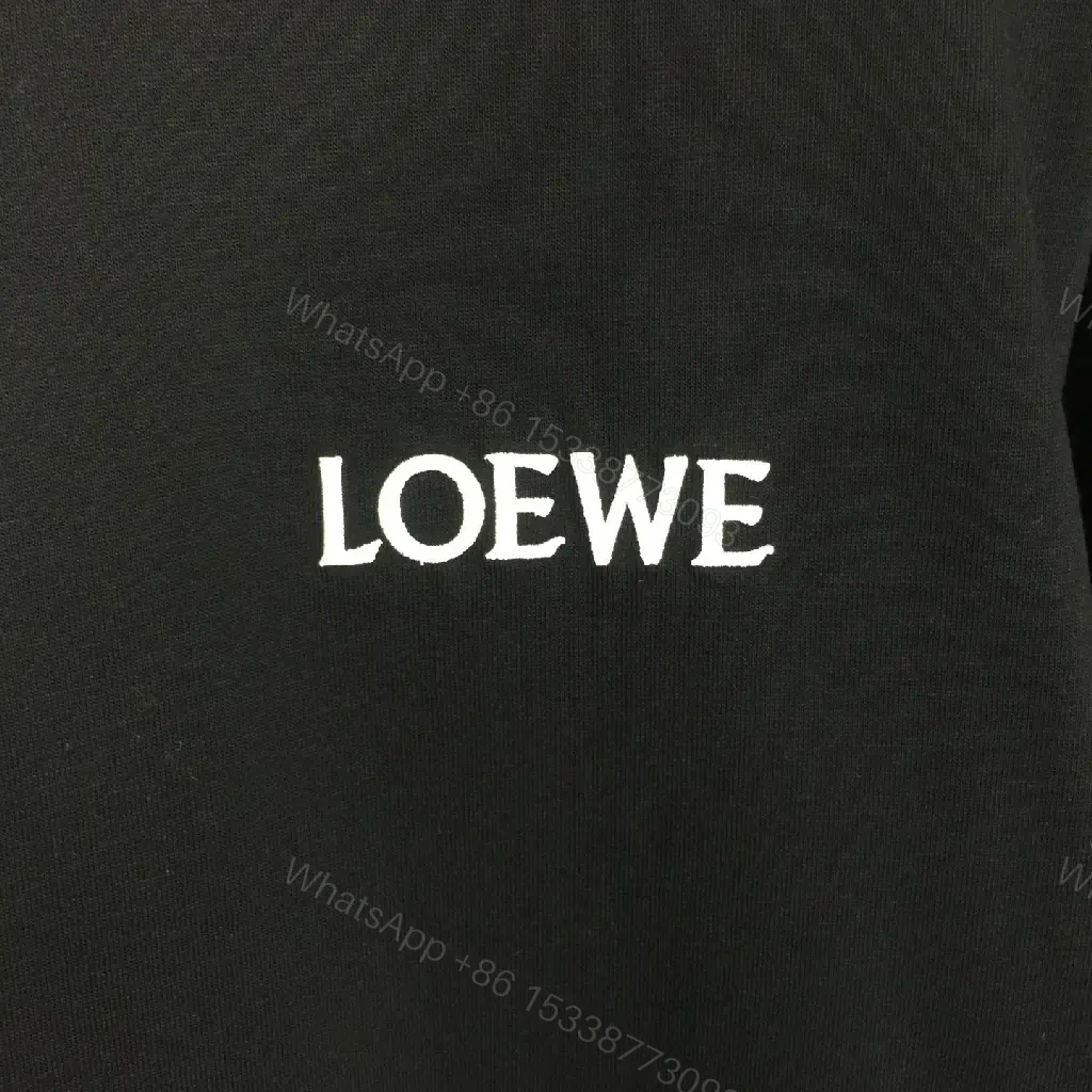 View 3 of Minimalist Black Tee: Subtle Branding, Everyday Luxury Tee