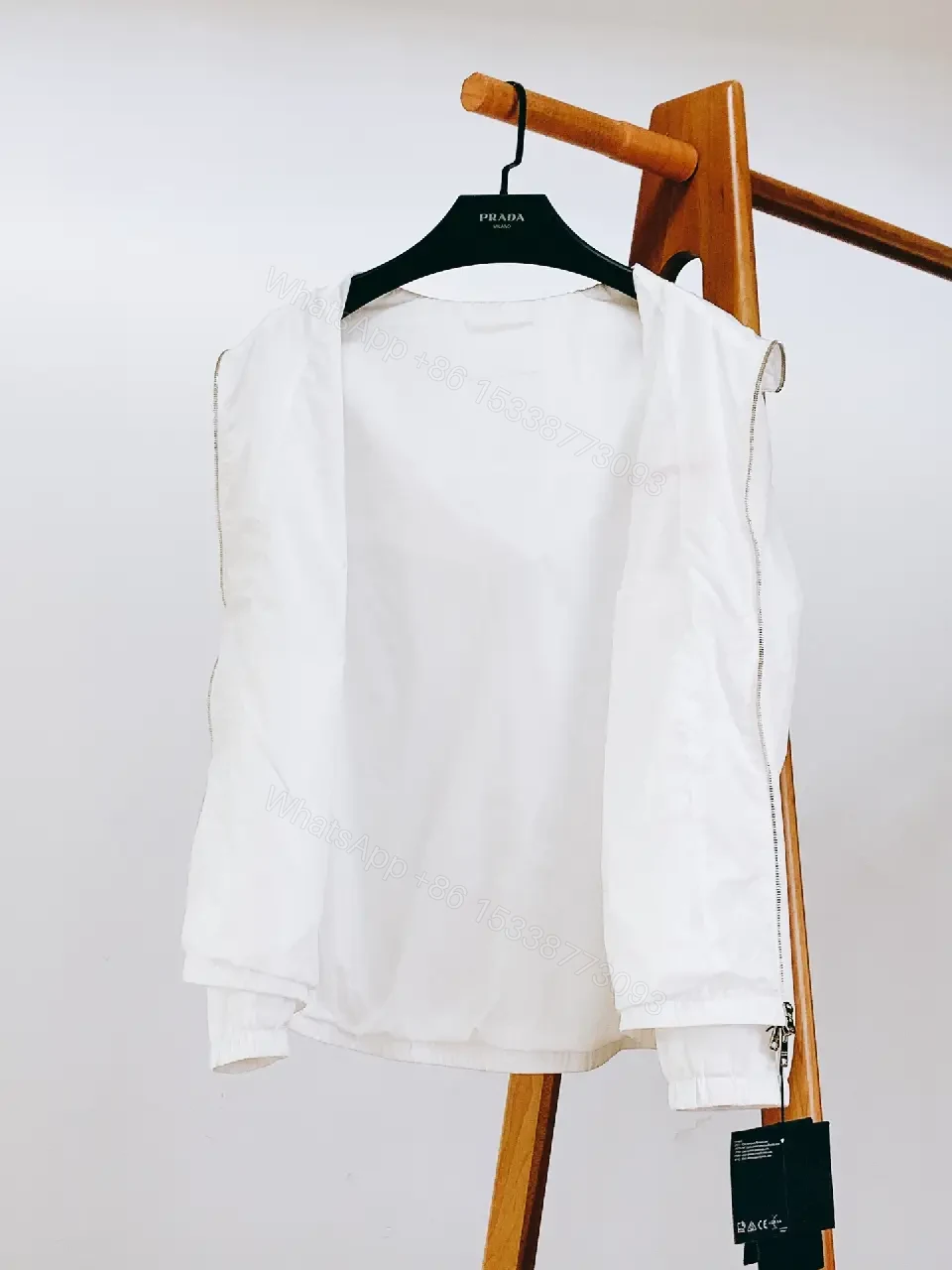 View 7 of White Nylon Windbreaker with Red Accent — Lightweight, Weather-Ready Outerwear