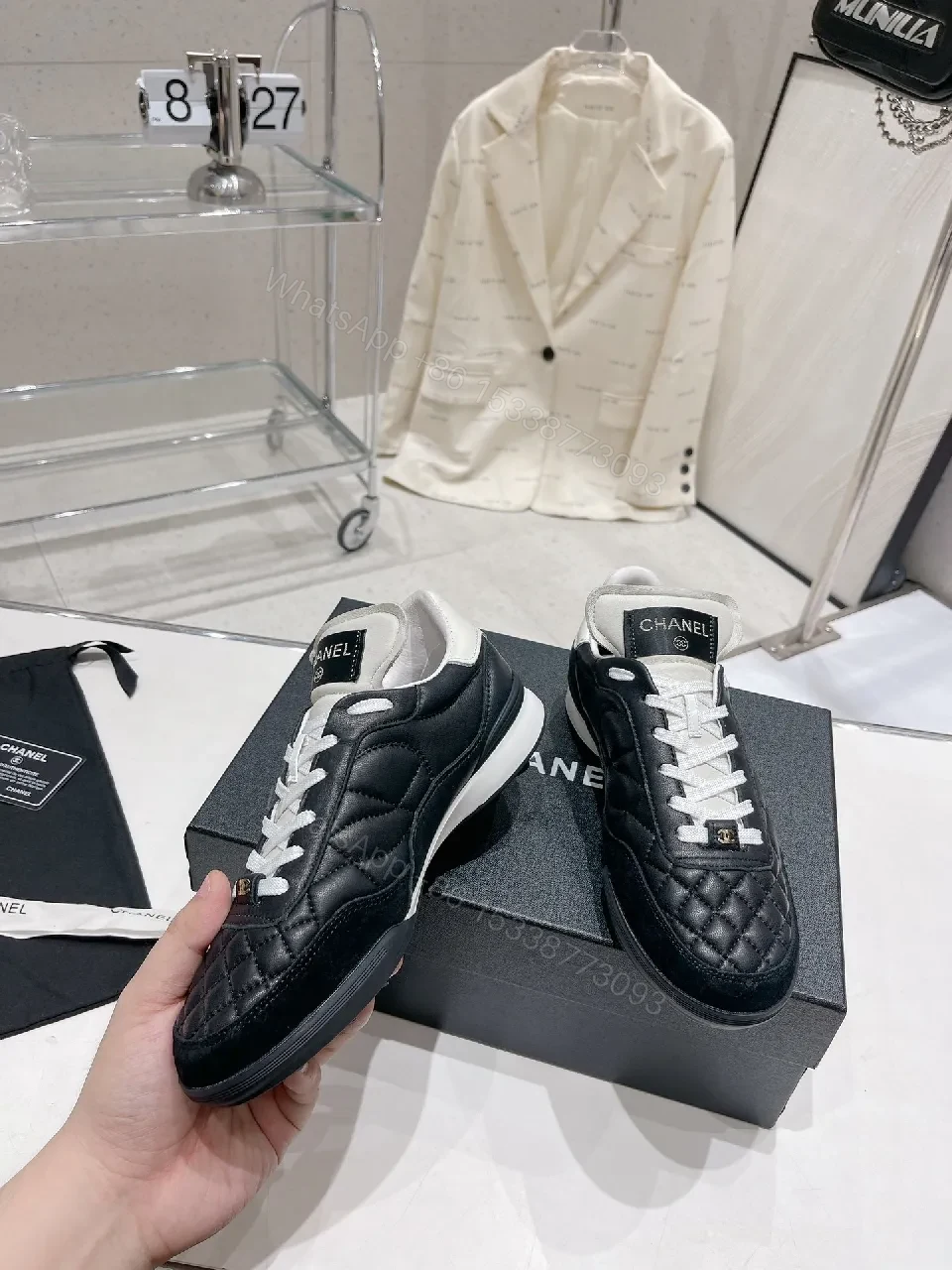 View 7 of Quilted Black Leather Sneakers with Luxe Branding Detail