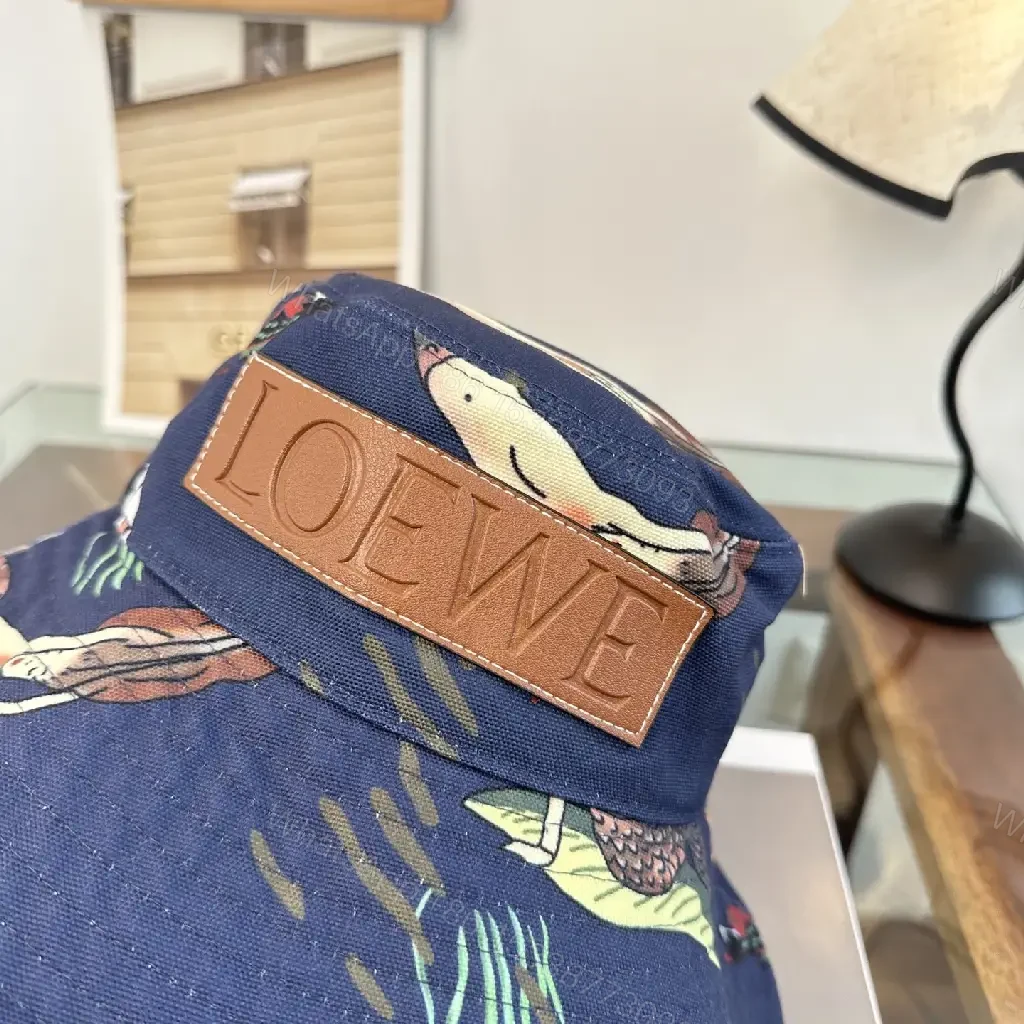 View 6 of Navy Floral Canvas Bucket Hat with Leather Brand Patch