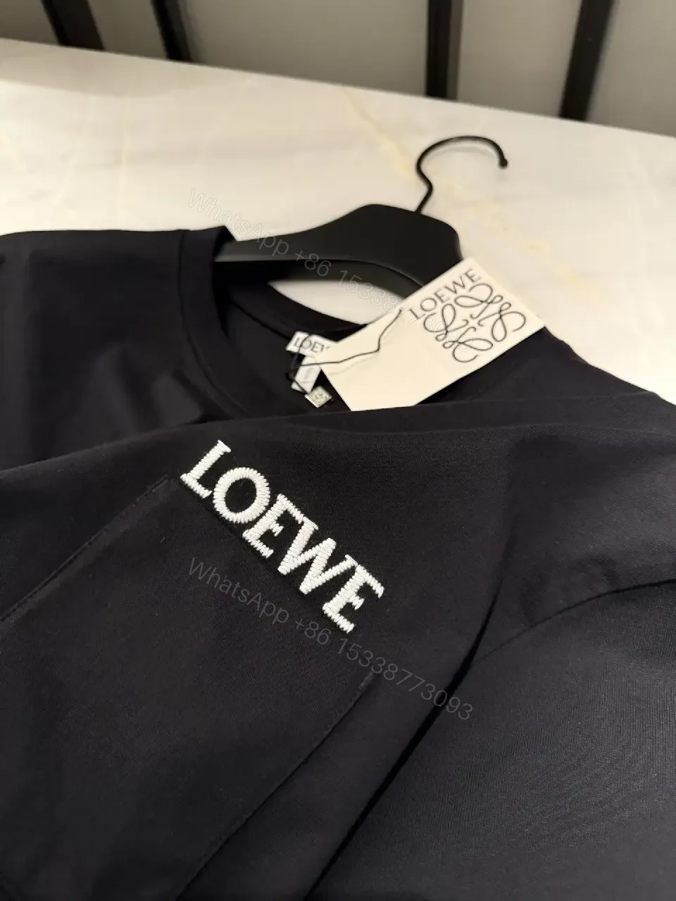 View 5 of Black Cotton Crew Tee with Pocket – Subtle Luxe Comfort