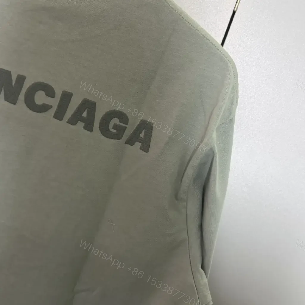 View 3 of Mint Green Minimalist Tee: Soft-Cotton, Refined Logo, Everyday Luxury