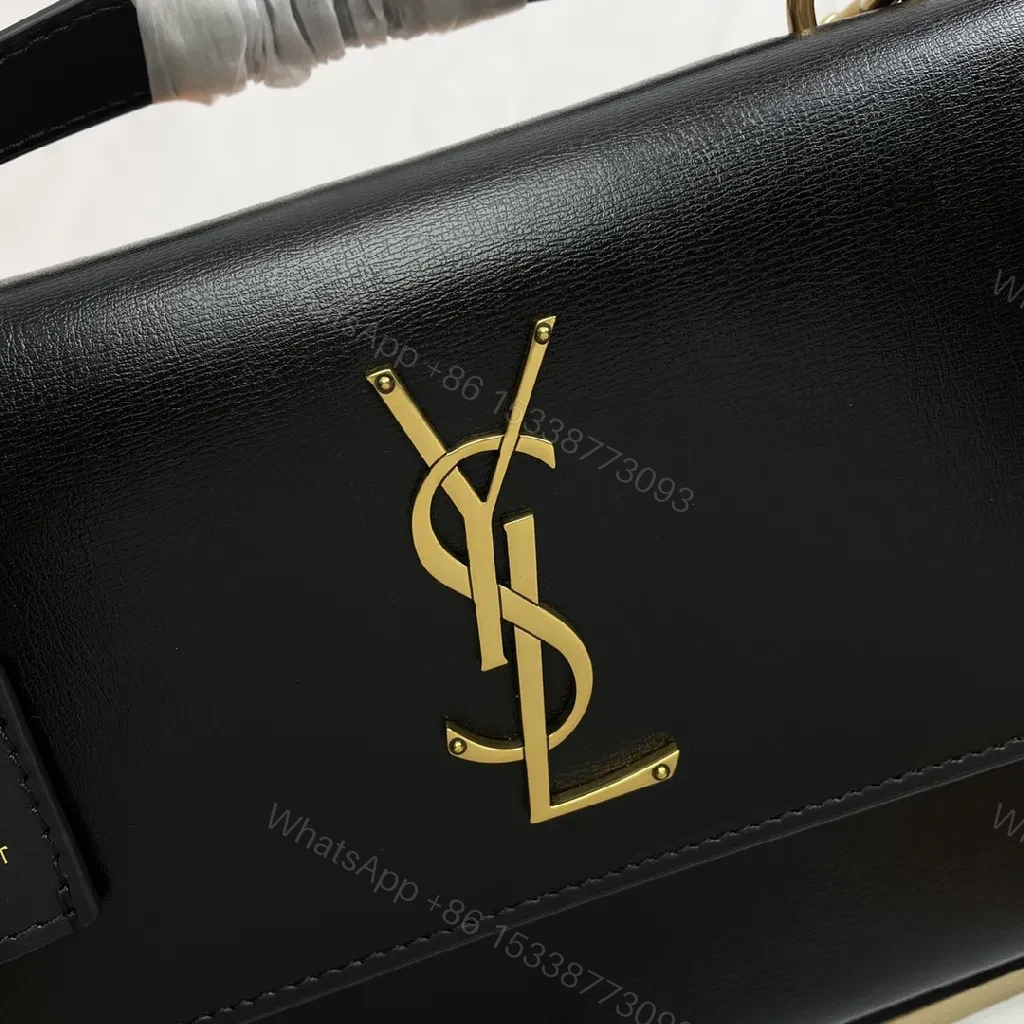 View 9 of Chic Black Leather Crossbody with Gold Emblem: Compact Luxury