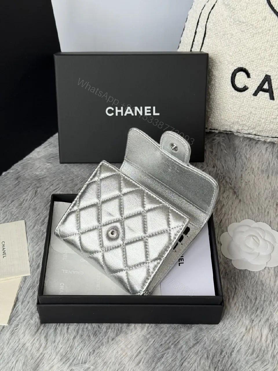 View 12 of Compact Silver Quilted Wallet with Signature Hardware