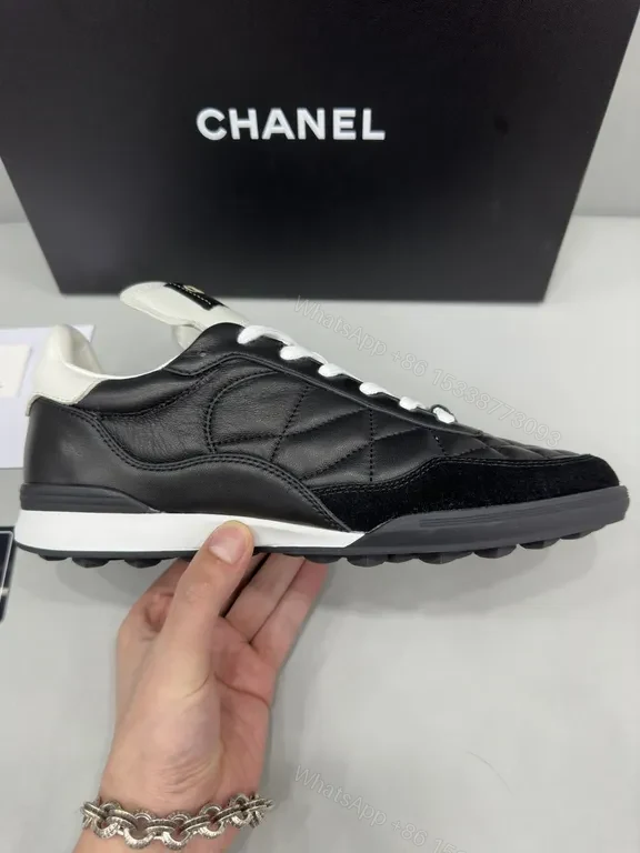 View 2 of Chanel-Quilted Leather High-Top Sneakers with Signature Details