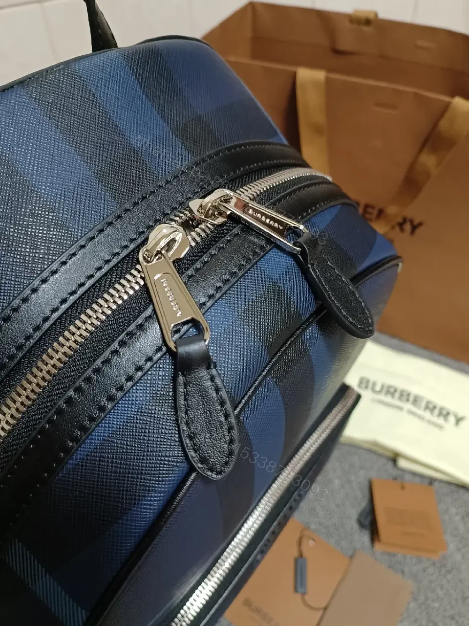 View 5 of Bold Check Pattern Leather-Accented Backpack for Everyday Luxury