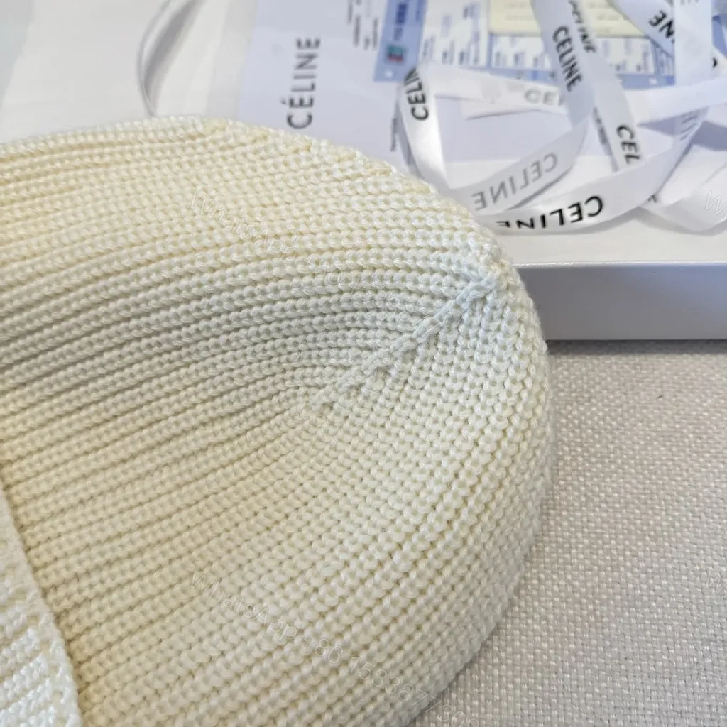 View 9 of Cream Knit Beanie + Ribbed Material + Minimalist Style + Subtle Monogram + Beanie