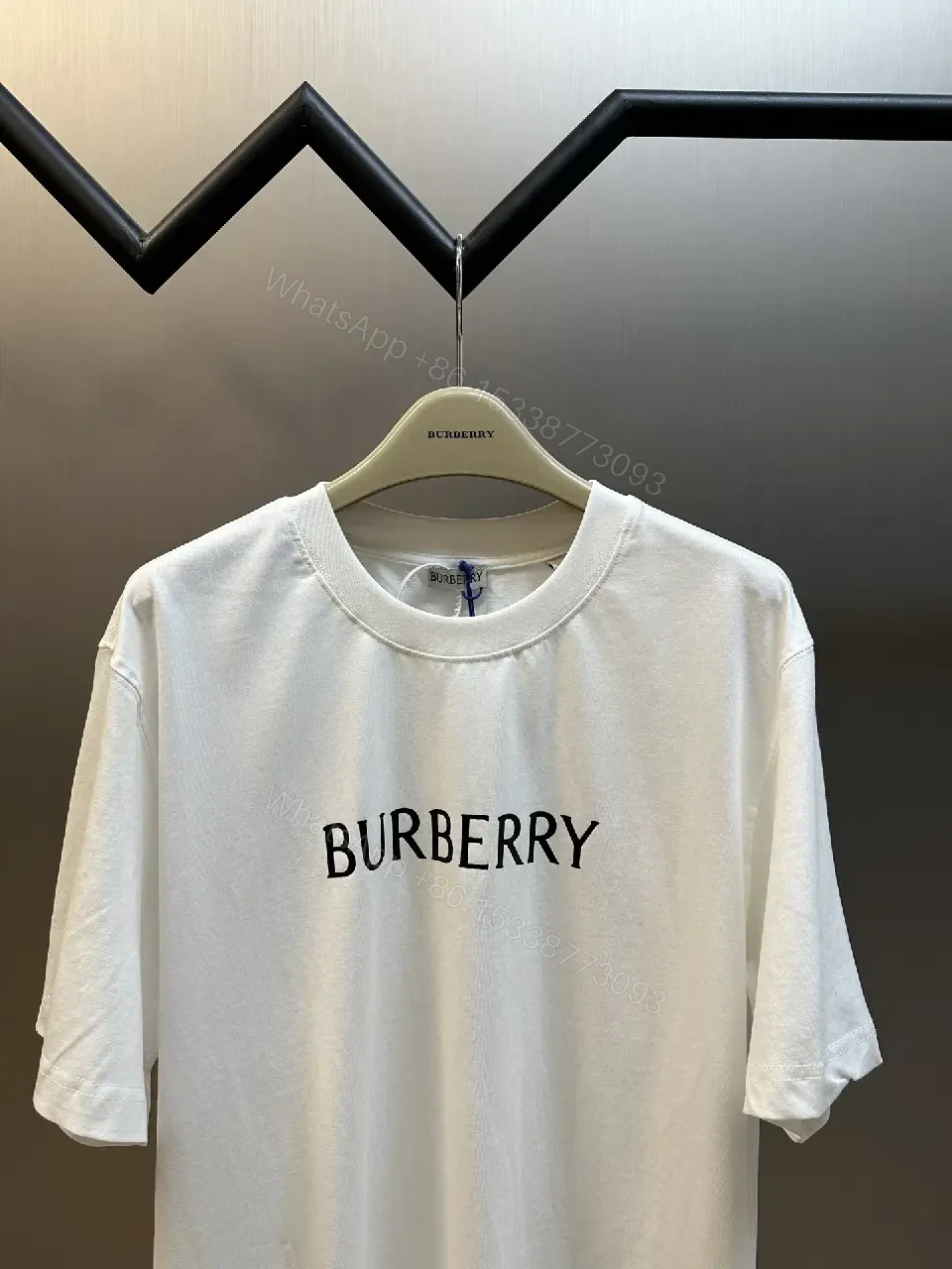 View 10 of Minimalist Burberry-Style White Cotton Tee: Elevated Everyday Comfort