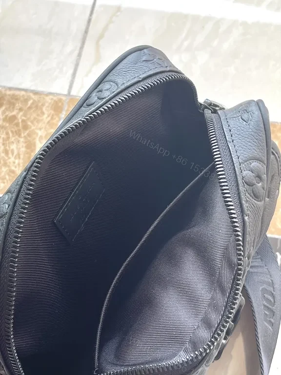 View 2 of Black Monogram Leather Messenger: Compact, Weather-Ready Luxury