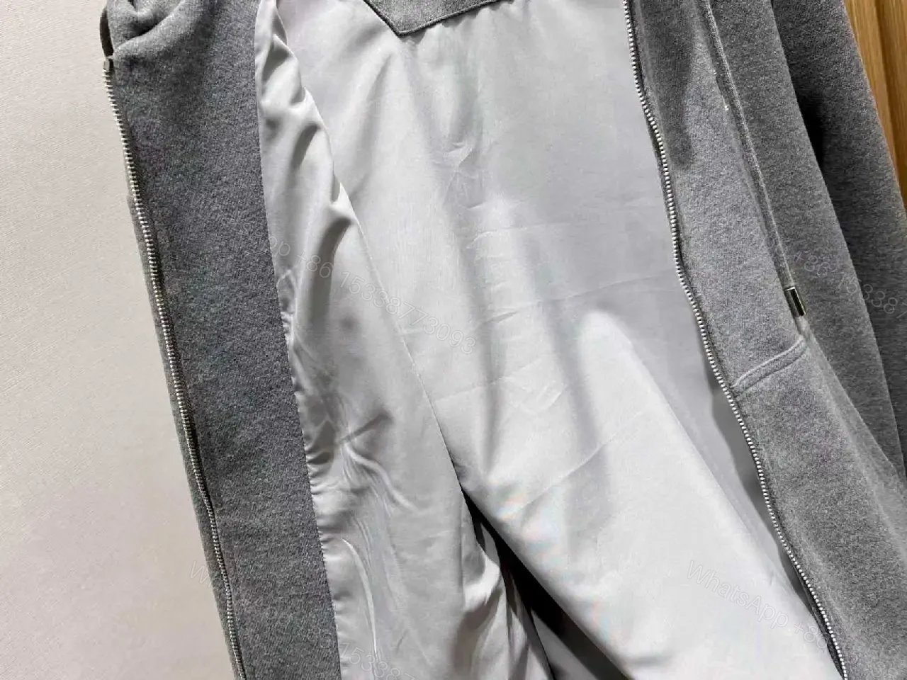 View 5 of Cozy Black Knit Zip Hoodie with Subtle Emblem Embellishment