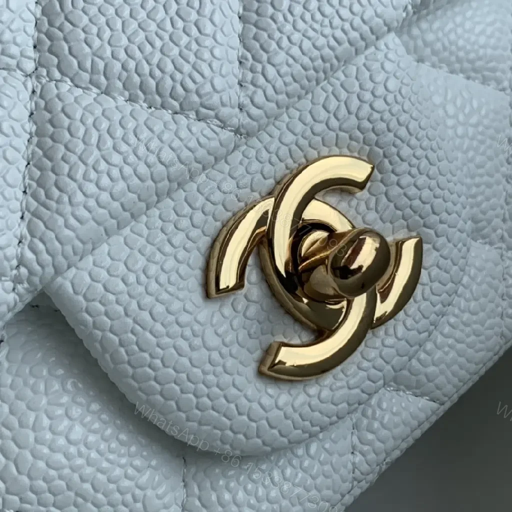 View 6 of Quilted White Flap Bag with Gold Hardware—Compact Elegance