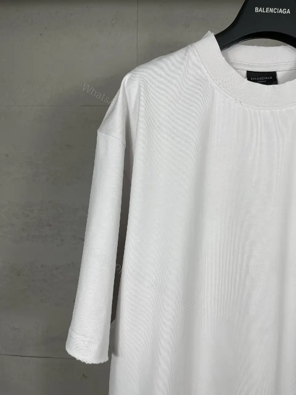 View 2 of Oversized White Tee with Signature Patch - Minimalist Luxe