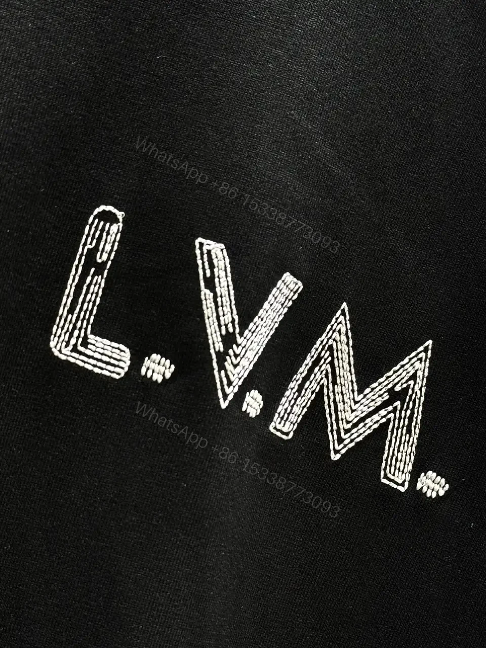 View 2 of Minimalist Black Cotton Tee with Subtle LV.M Logo