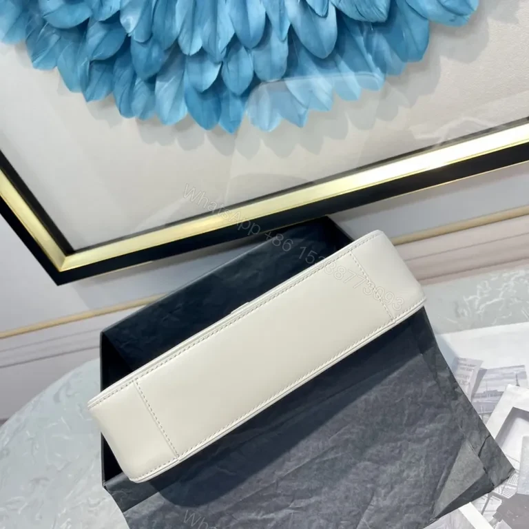 View 9 of Minimalist White Leather Handbag with Gold YSL Accent