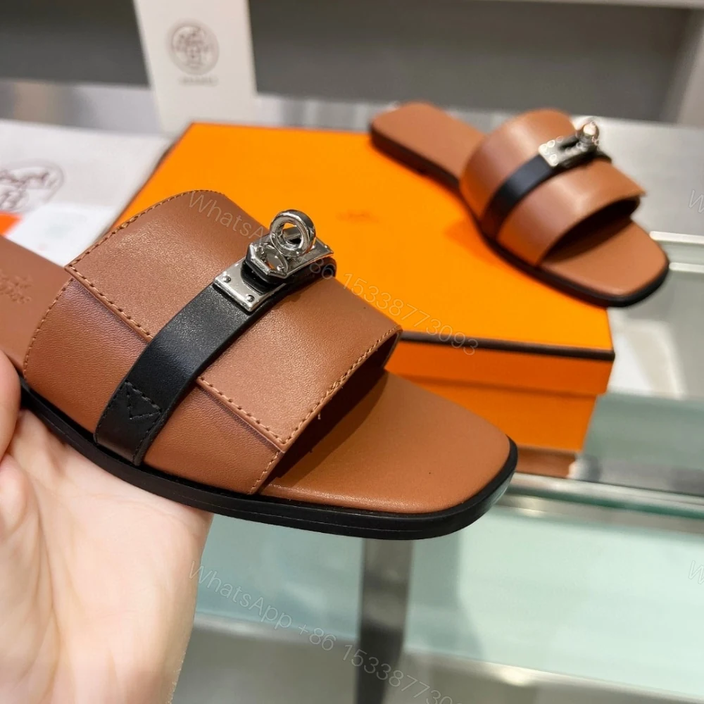 View 7 of HERMES GIULIA SANDAL GOLD AND NOIR H231056Z 20360