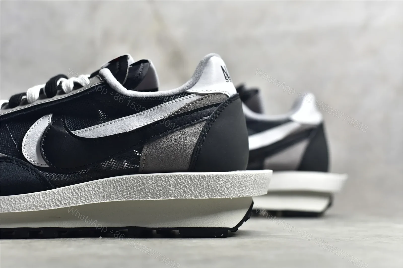 View 4 of Sacai × Nike Waffle Black and White Reps