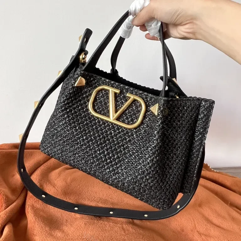 View 6 of Black Woven Luxe Handbag: Compact, Gold-Accent Style Bag