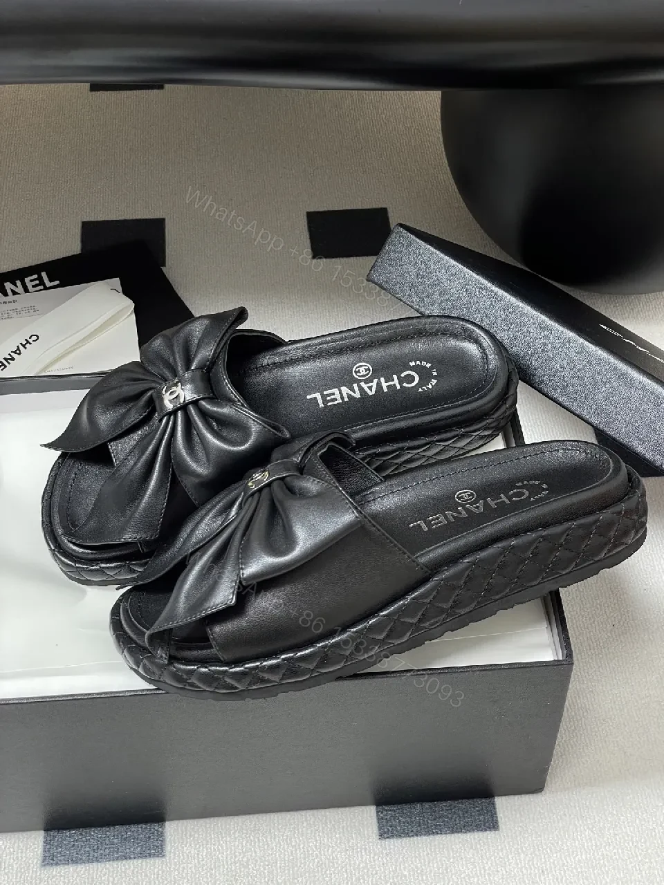 View 3 of Chic Black Quilted Slides with Bow Detail - Luxury Casual Platform