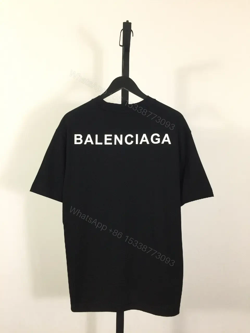 View 5 of Minimalist Black Mockneck Tee: Premium Cotton, Subtle Logo, Versatile Style