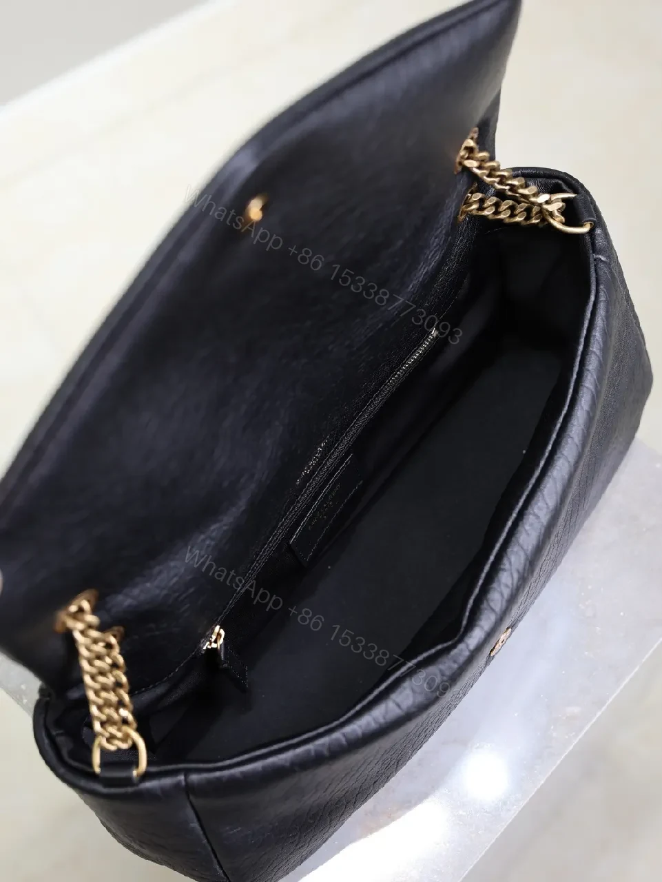 View 2 of Textured Leather Crossbody Clutch with Gold Logo hardware
