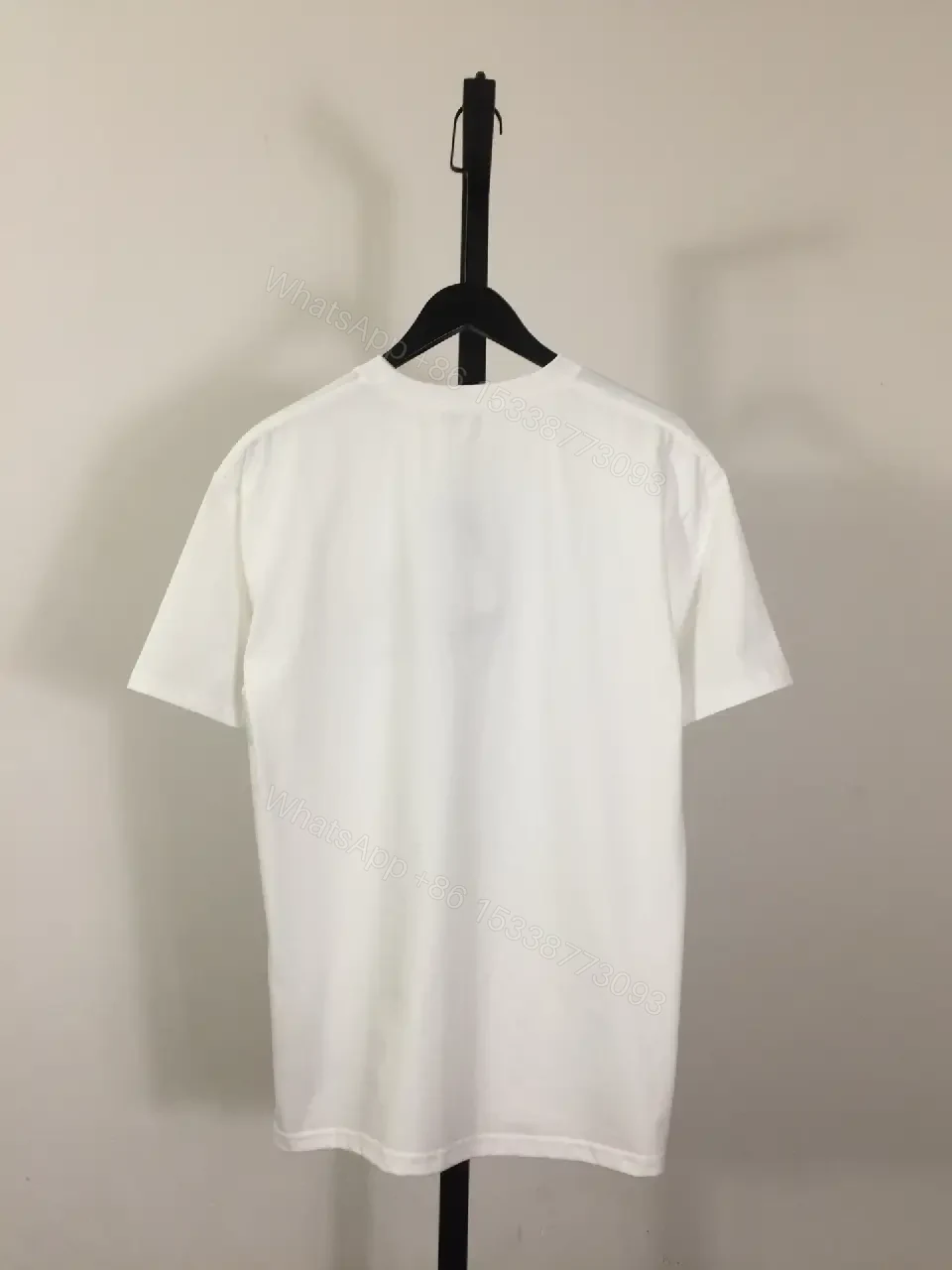 View 5 of White Cotton Tee with Embroidered Pony – Subtle Luxury Style