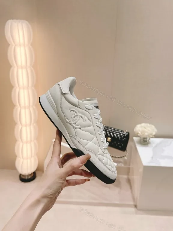 View 2 of White Quilted Platform Sneakers with Chanel Detailing