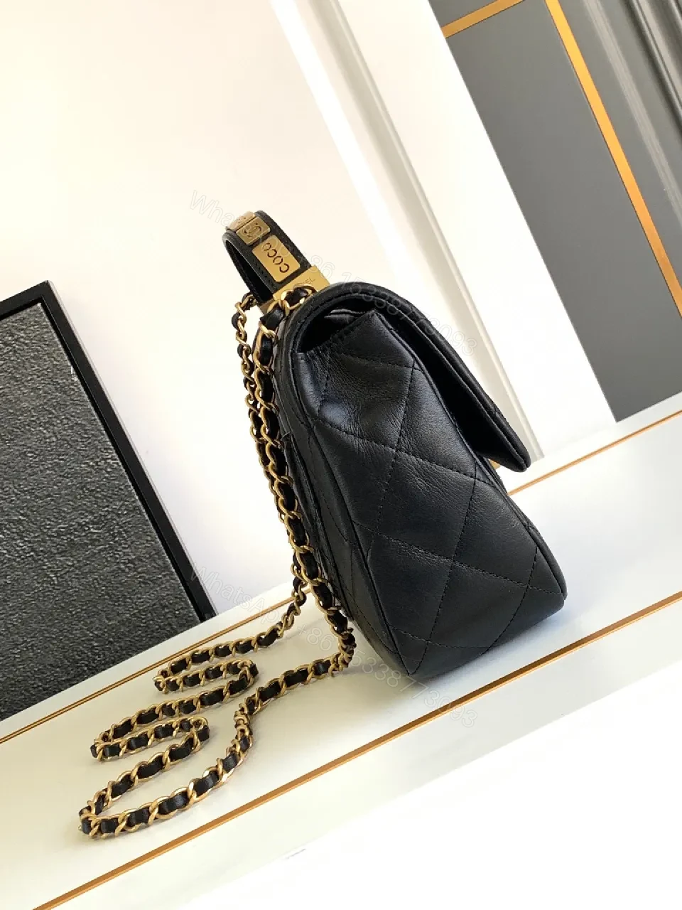 View 4 of Compact Dark Leather Quilted Flap Bag with Gold Hardware