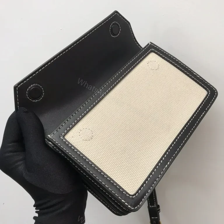 View 7 of Beige Canvas & Black Leather Crossbody: Bold Brand Duo
