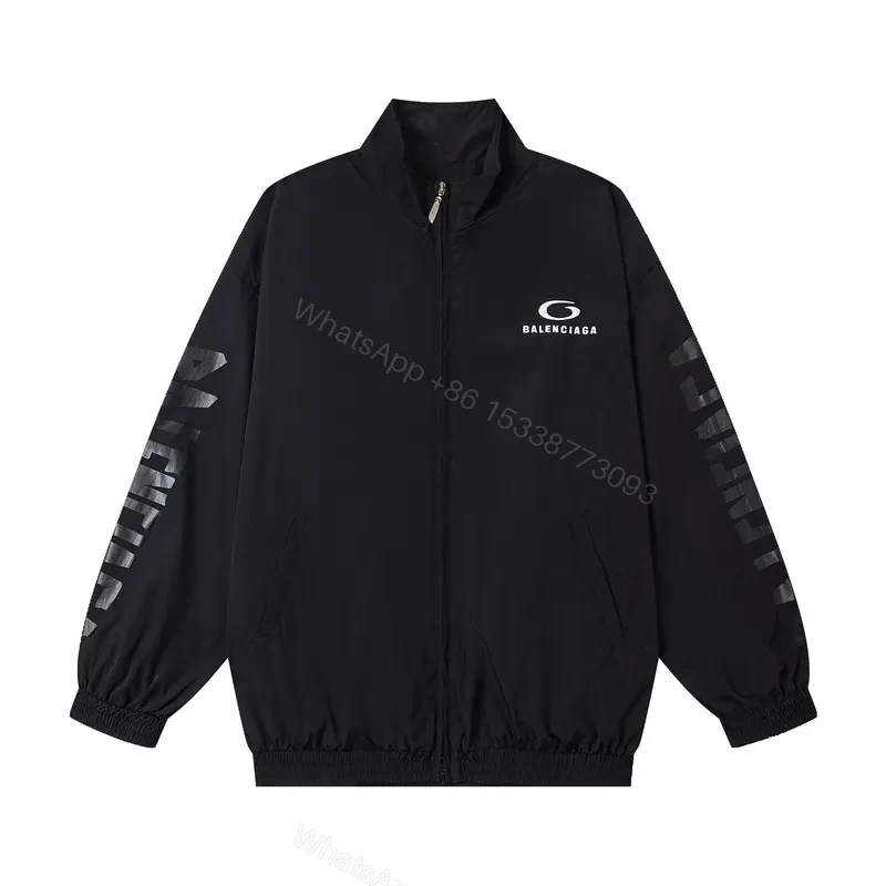 Minimalist Black Windbreaker: Subtle Branding, All-Season Outerwear — view 1