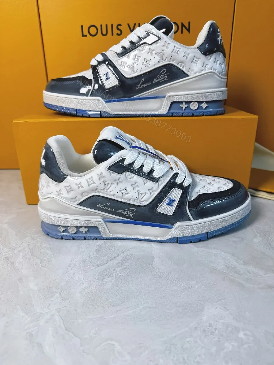 View 7 of Bold Navy Leather Textured Sneakers with LV Accent