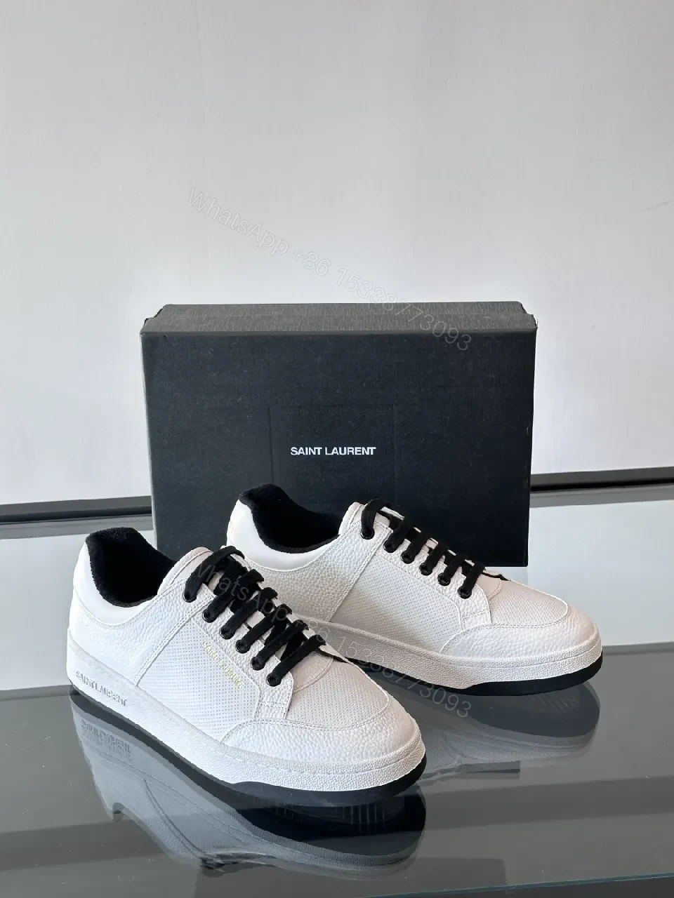White Leather Sneaker with Black Accents — Minimalist Luxury Sneaker — view 1