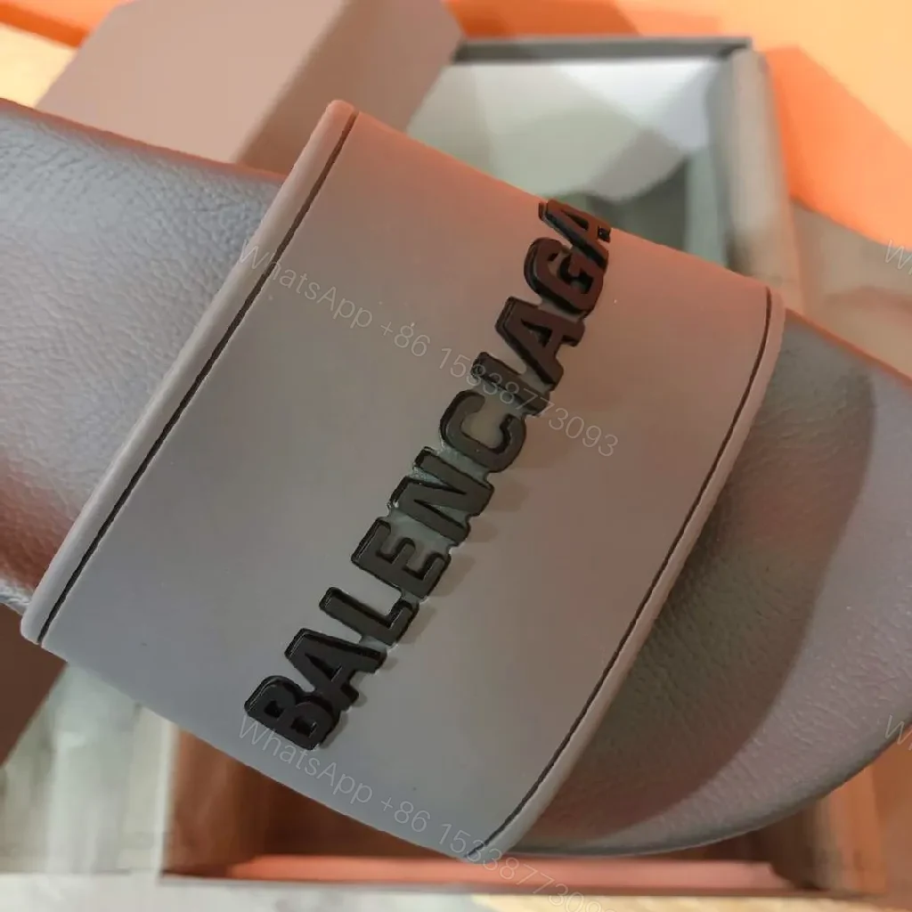 View 5 of Minimalist Designer Slides in Neutral Faux Leather with Bold Logo Strap