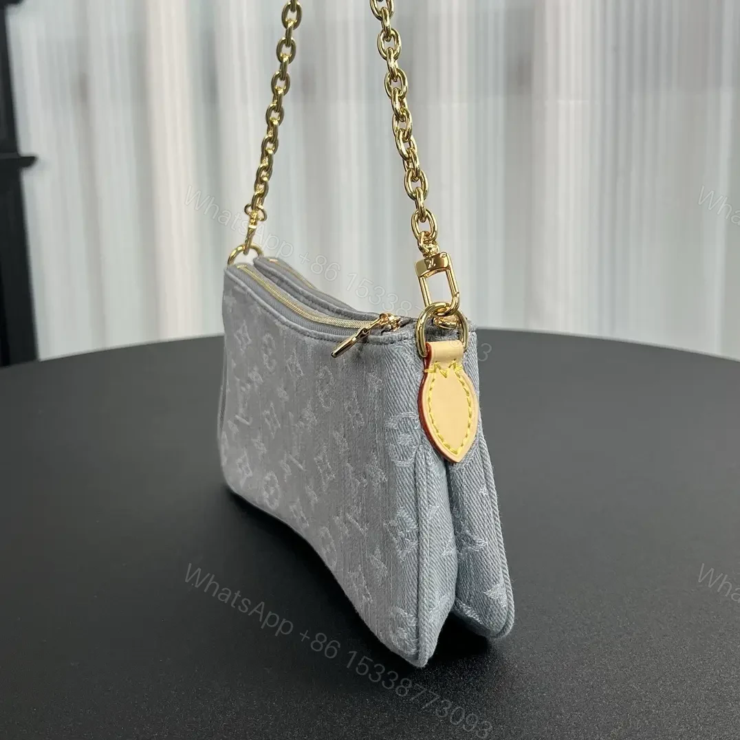 View 7 of Louis Vuitton Liv Pochette in Washed Denim