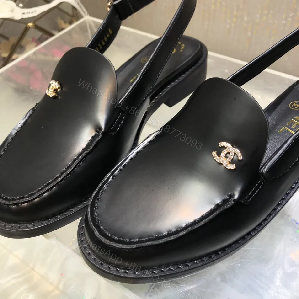 View 3 of Black Leather Mules with Gold Logo Hardware, Minimal Slider Mule