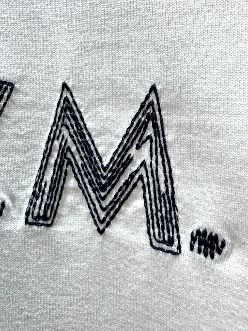 View 7 of Minimalist White Tee with Subtle L.V.M. Logo—Premium Everyday Essential