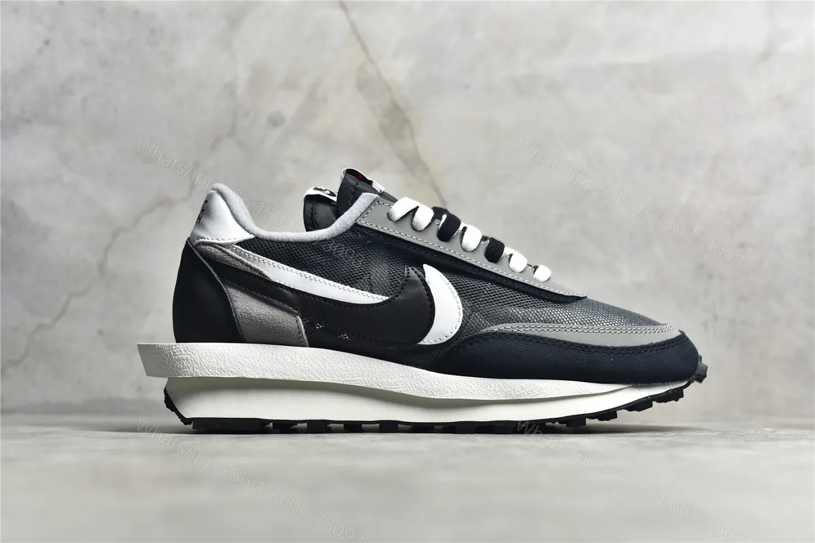 View 3 of Sacai × Nike Waffle Black and White Reps