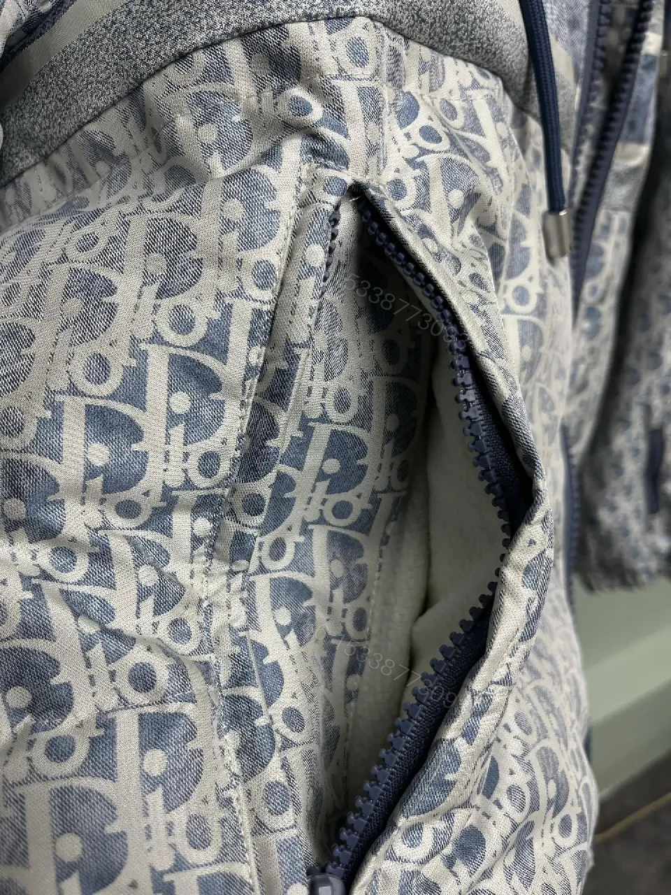 View 10 of Monochrome Puffer Jacket: Monogram Texture, Modern Warmth, Street-Ready Outerwear