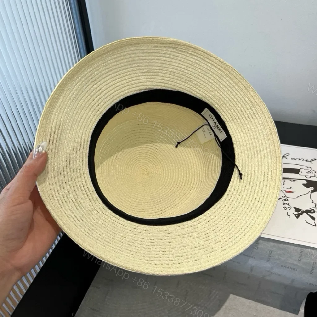 View 2 of Natural Straw Bucket Hat with Signature Band, Chic ResortStyle