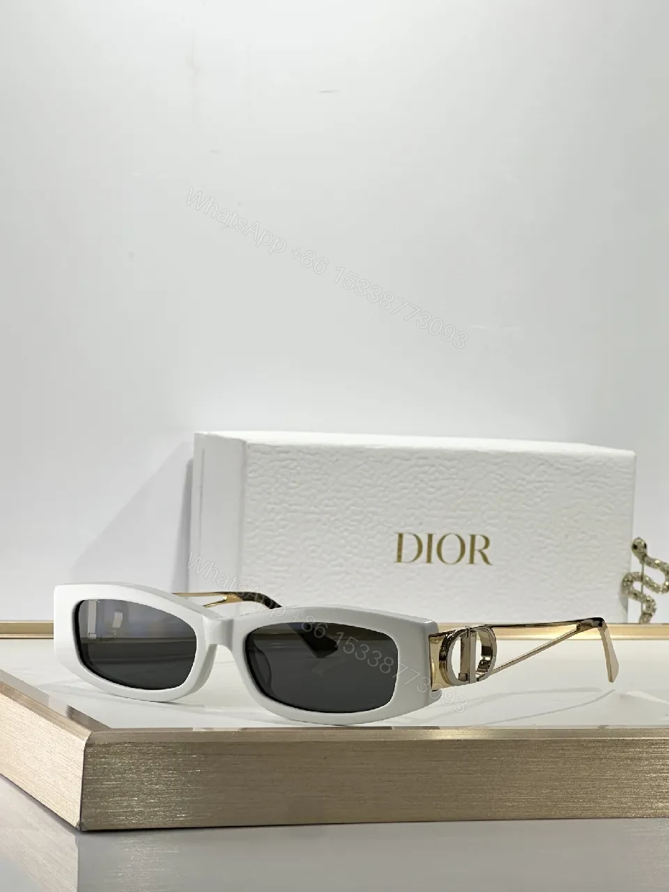 White Rectangular Sunglasses with Dior-Gold Accents: Modern Luxury Sideways — view 1