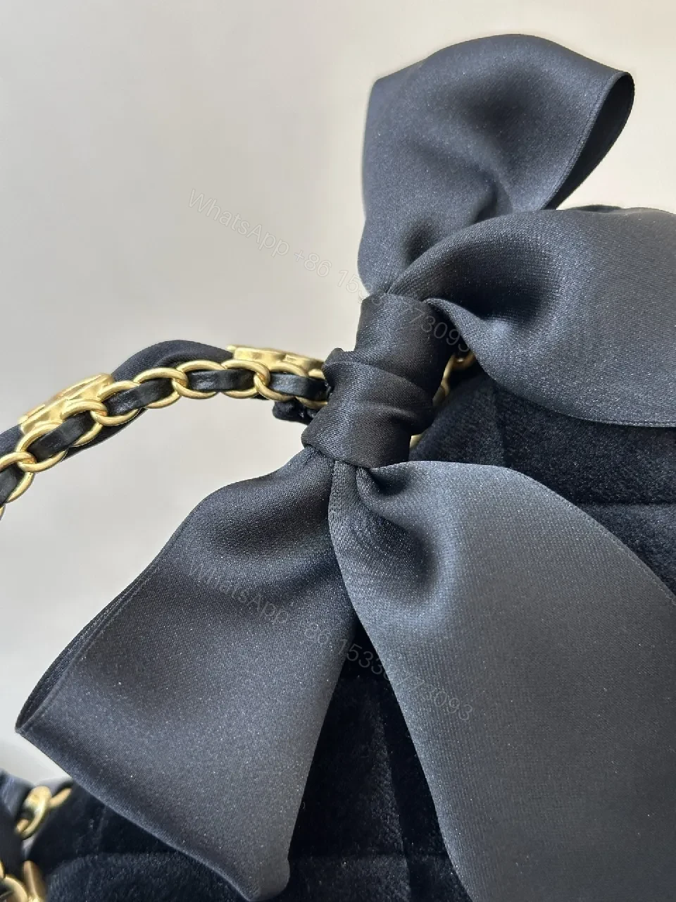 View 2 of Quilted Velvet Handbag with Satin Bow Accent and Gold Chain