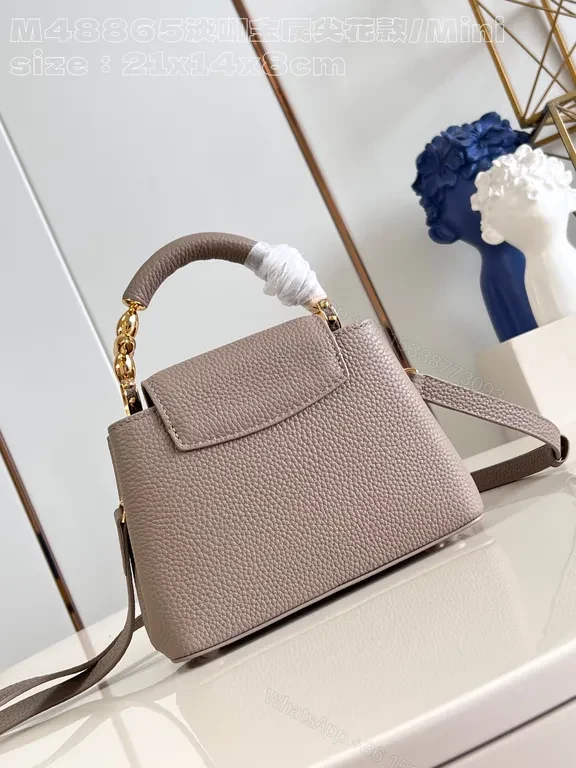 View 8 of Taupe Pebbled Leather Crossbody: Gold LV Accent, Compact Luxury Bag