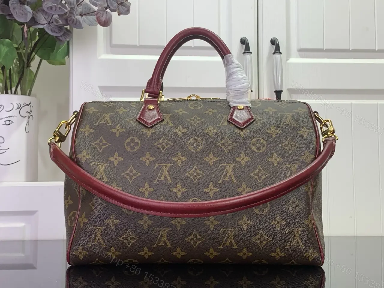 View 5 of Brown Canvas LV Monogram Travel Handbag with Burgundy Leather Trim