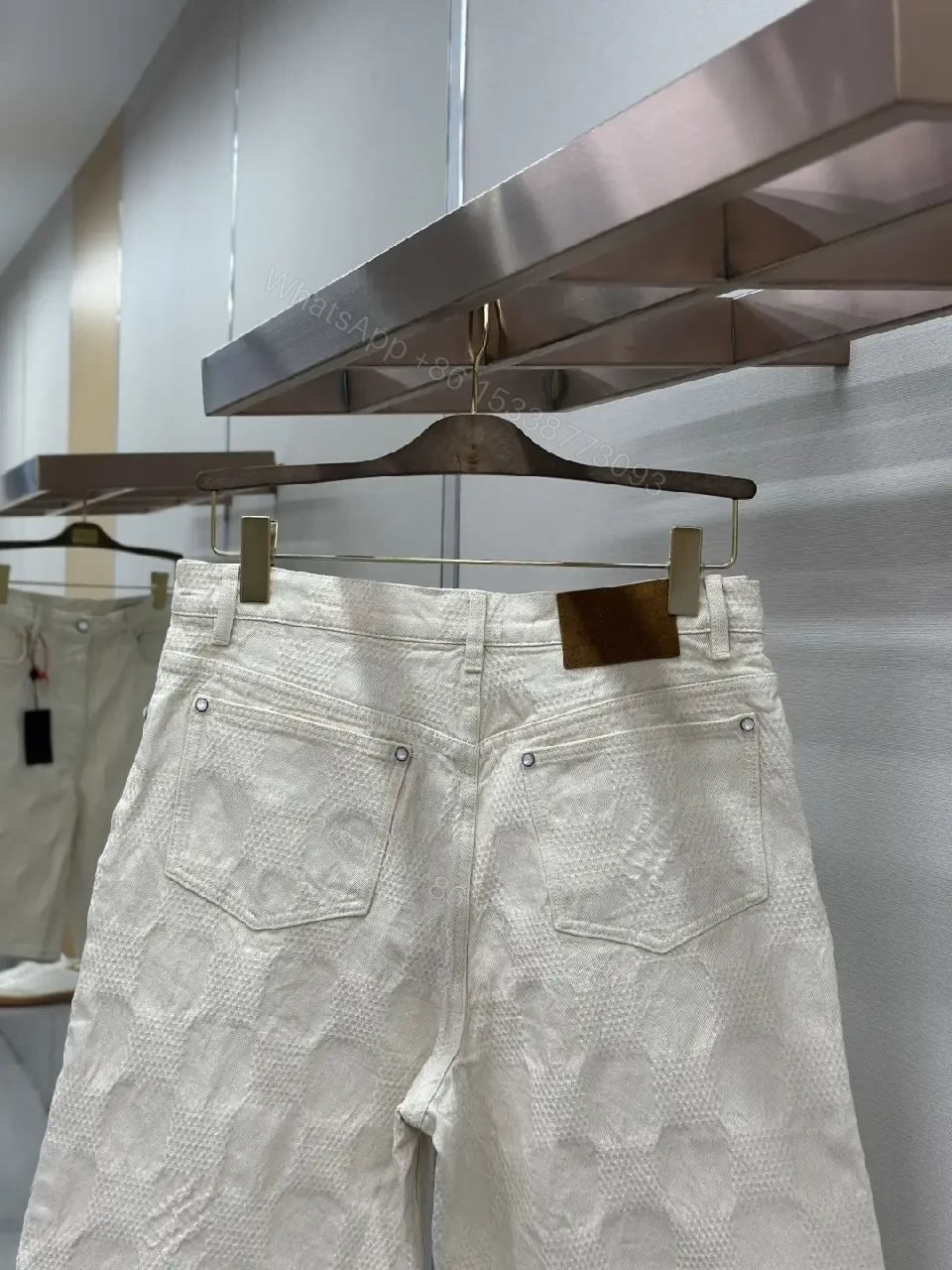 View 8 of Beige textured cotton-blend shorts with monogram-inspired print for everyday luxury